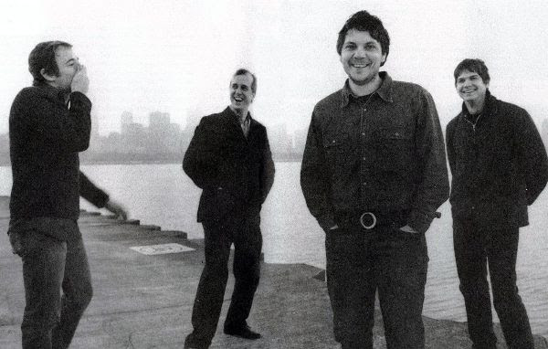 wilco standing by a lake